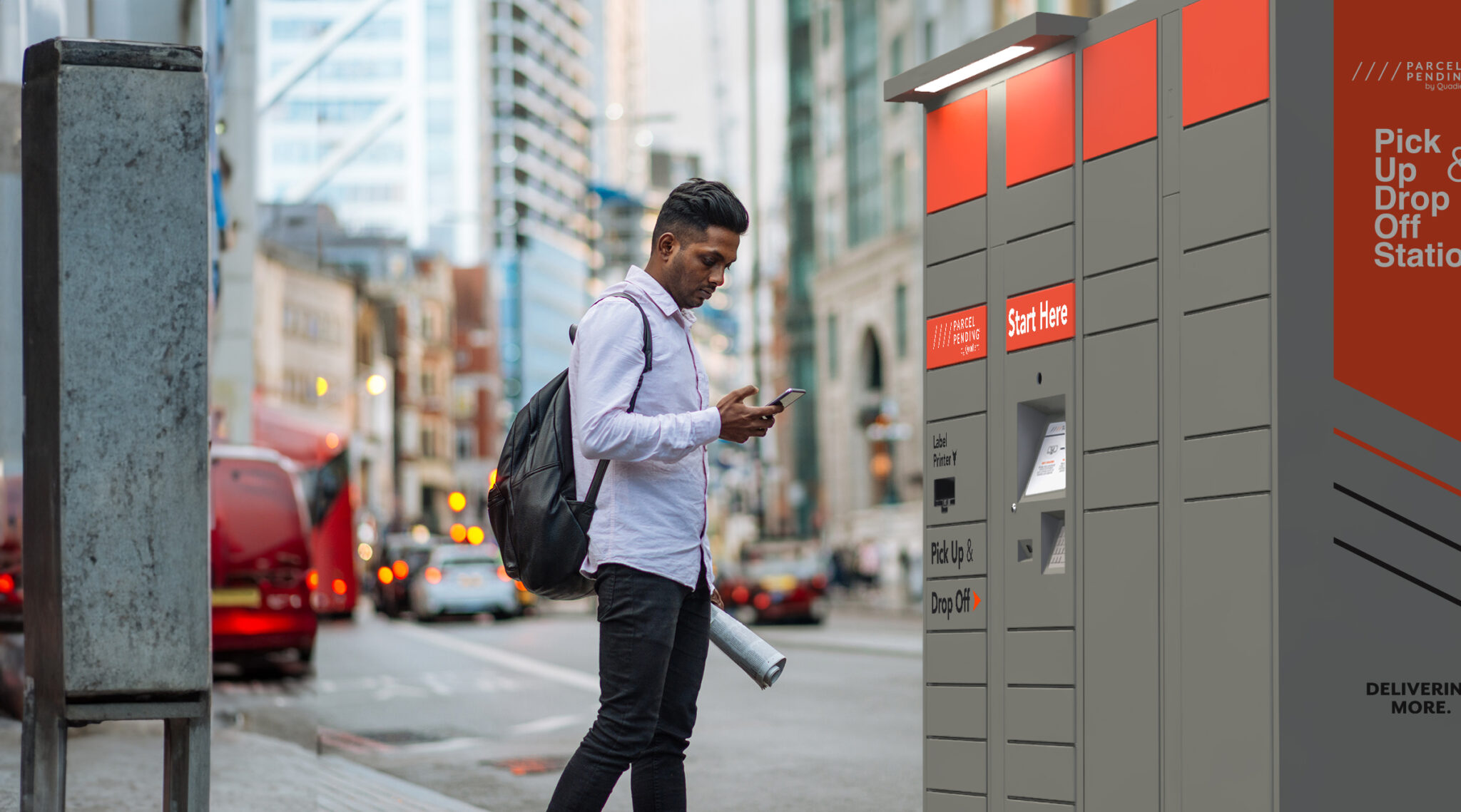 Indian young man in London, crossing the busy street while multi tasking